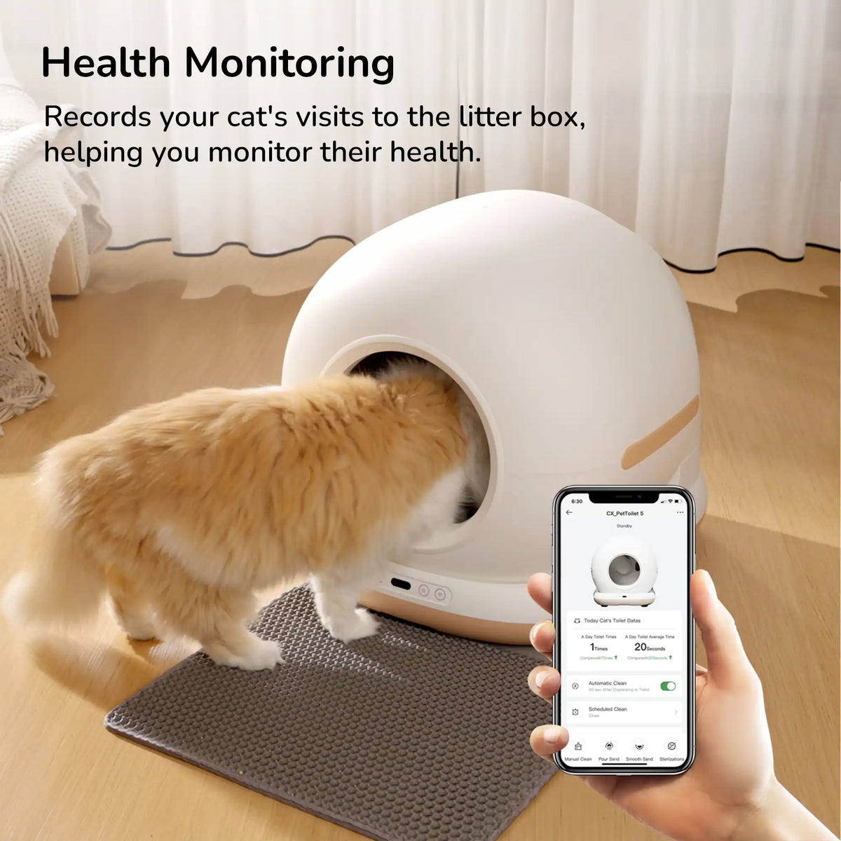 A cat entering a white automatic litter box with a smartphone showing health‑monitoring data on screen.