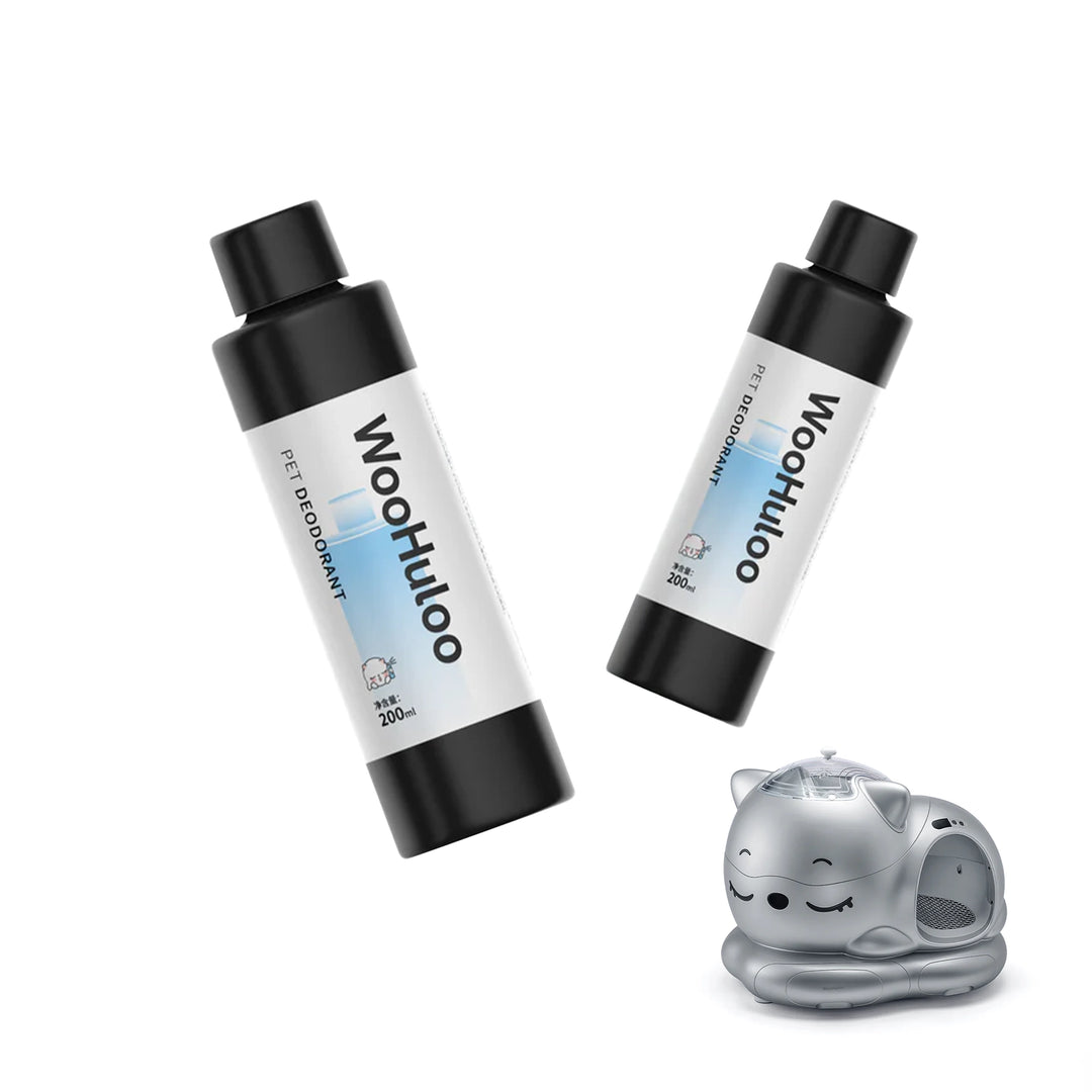 Two black‑capped WooHuluo pet deodorant bottles with blue labels floating above a silver smart cat litter box.
