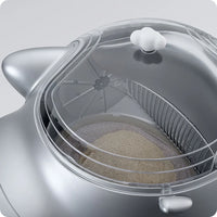 Top view of a silver smart cat litter box showing the interior compartment.