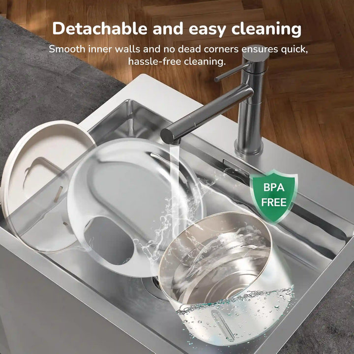 Detachable pet water fountain parts being rinsed in a kitchen sink