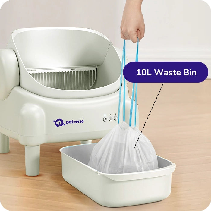 Petverse automatic litter box showing removable 10 L waste bin with hand lifting a bag inside.