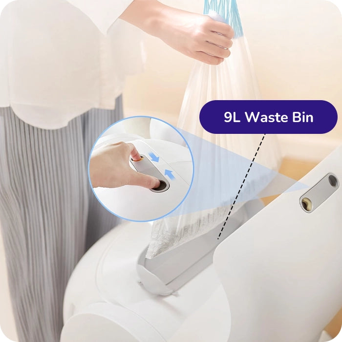 Hand placing a trash bag into the automatic cat litter box’s 9 L waste bin opening.