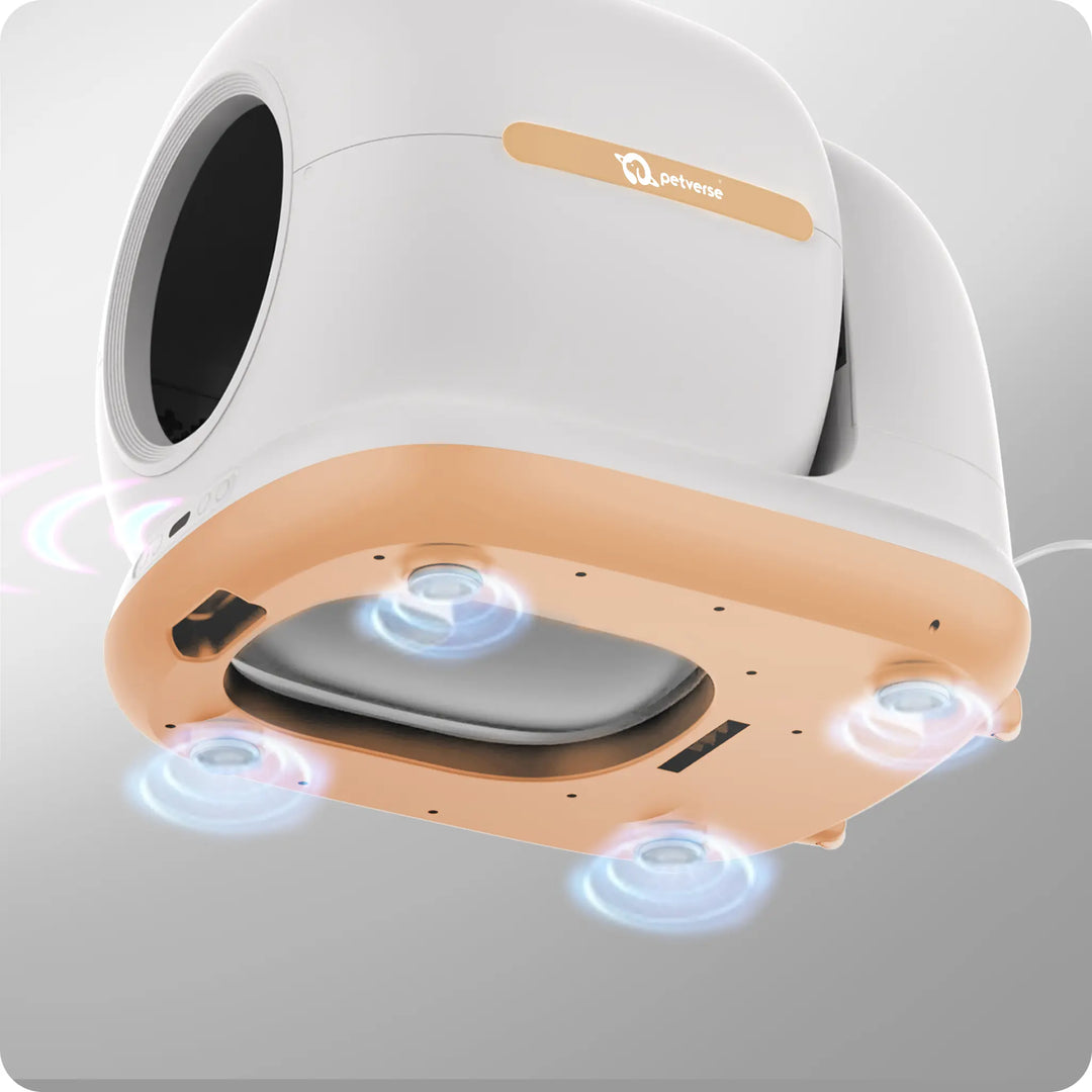 Underside of a white and beige automatic cat litter box showing sensor‑style lights at the base.