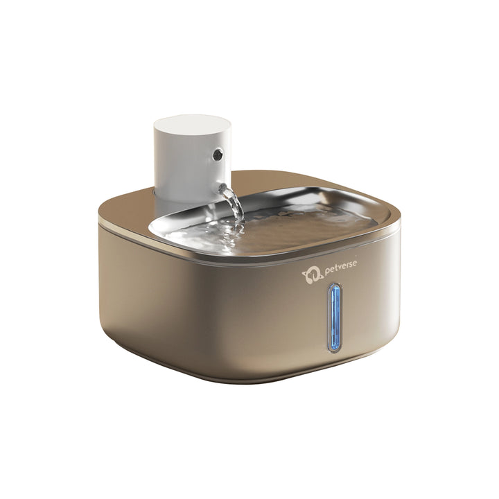Automatic pet water fountain with top spout pouring fresh water into a stainless basin