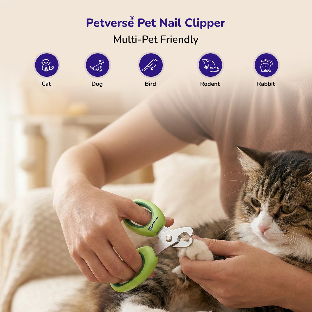 Person trimming a cat’s nails with green‑handled multi‑pet nail clippers 