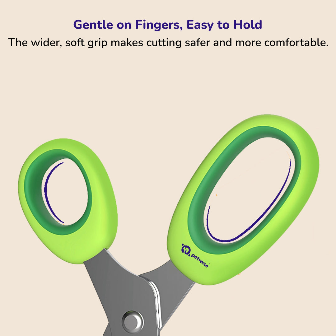Pet nail clippers with bright green ergonomic handles on a simple light background.